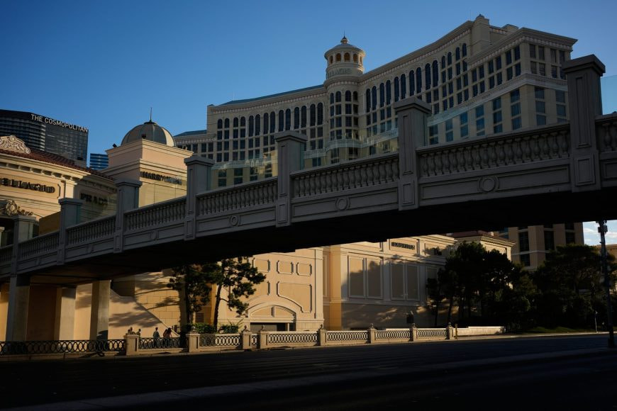 People walk by the Bellagio hotel and casino along the Las Vegas Strip, Thursday, April 30, 2026, in Las Vegas. (AP Photo/John Locher)